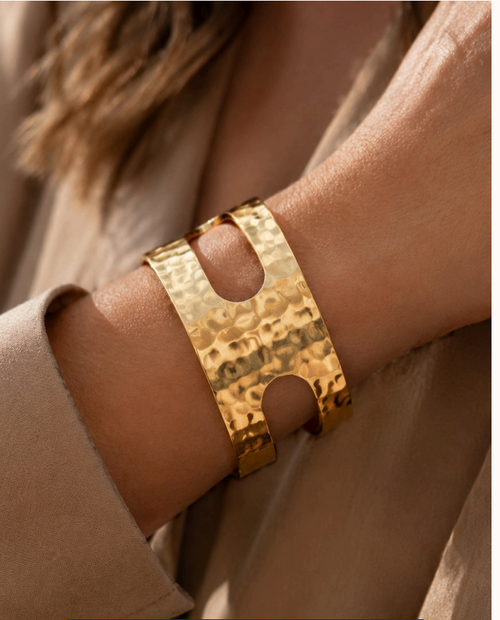 Thread Count hammered gold cuff with twin scarf slots, worn on the wrist