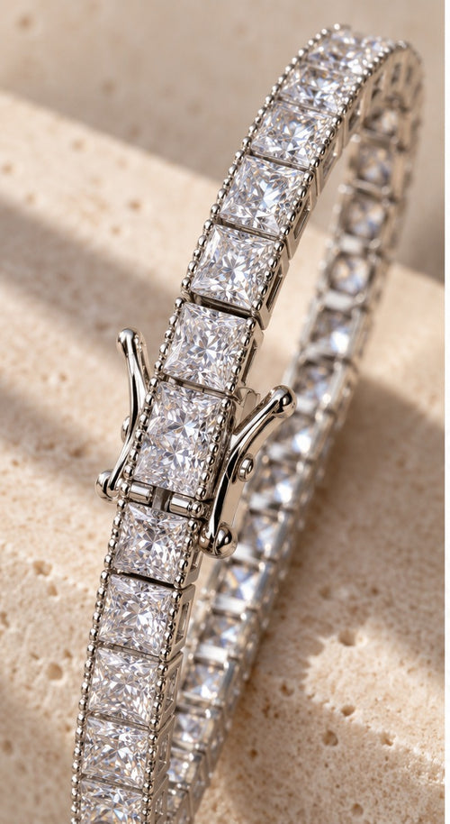 Straight Sets sterling silver tennis bracelet: channel-set princess-cut stones between beaded rails, box clasp