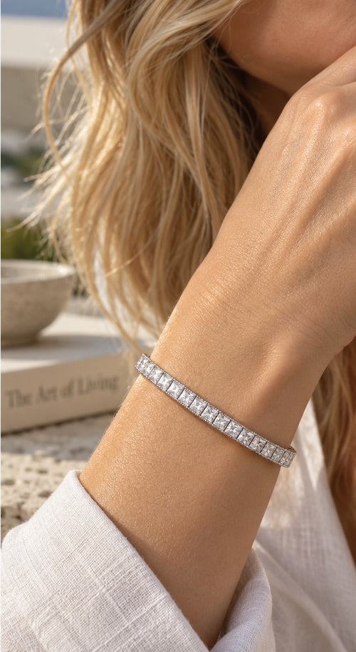 Straight Sets princess-cut tennis bracelet worn on the wrist