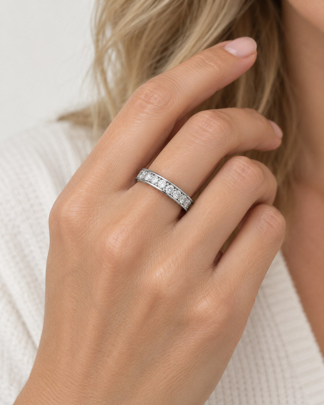 Straight Talk channel-set silver band worn on the hand