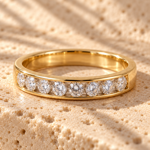 Straight Talk Gold macro close-up: channel-set half-eternity row of round clear stones in the gold band