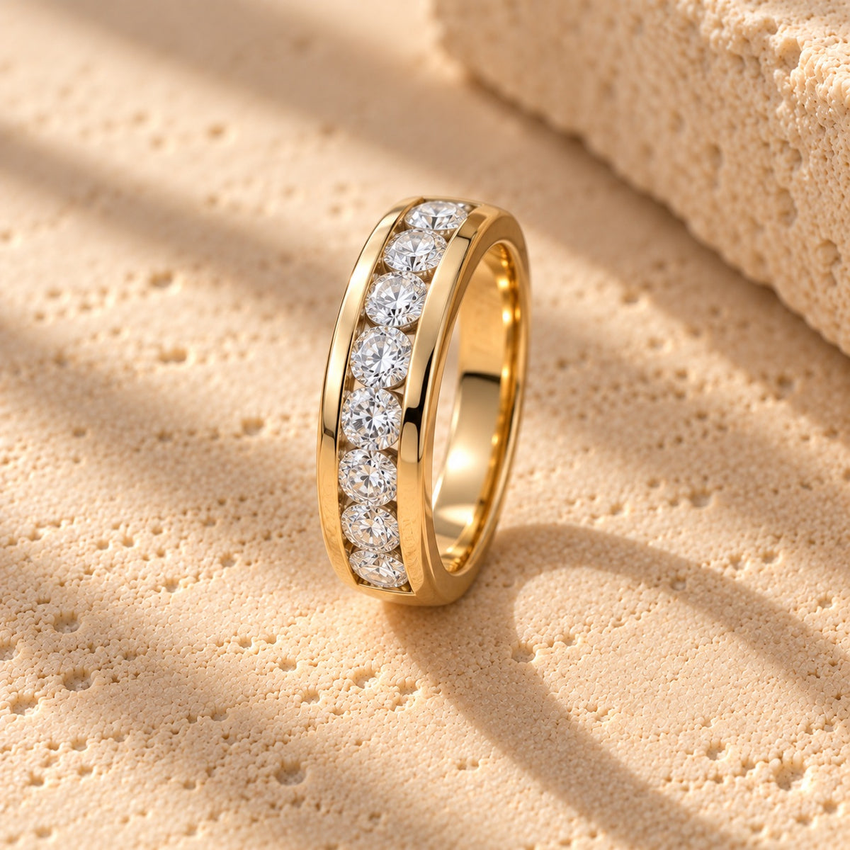 Straight Talk gold channel-set half-eternity band with round clear cubic zirconia