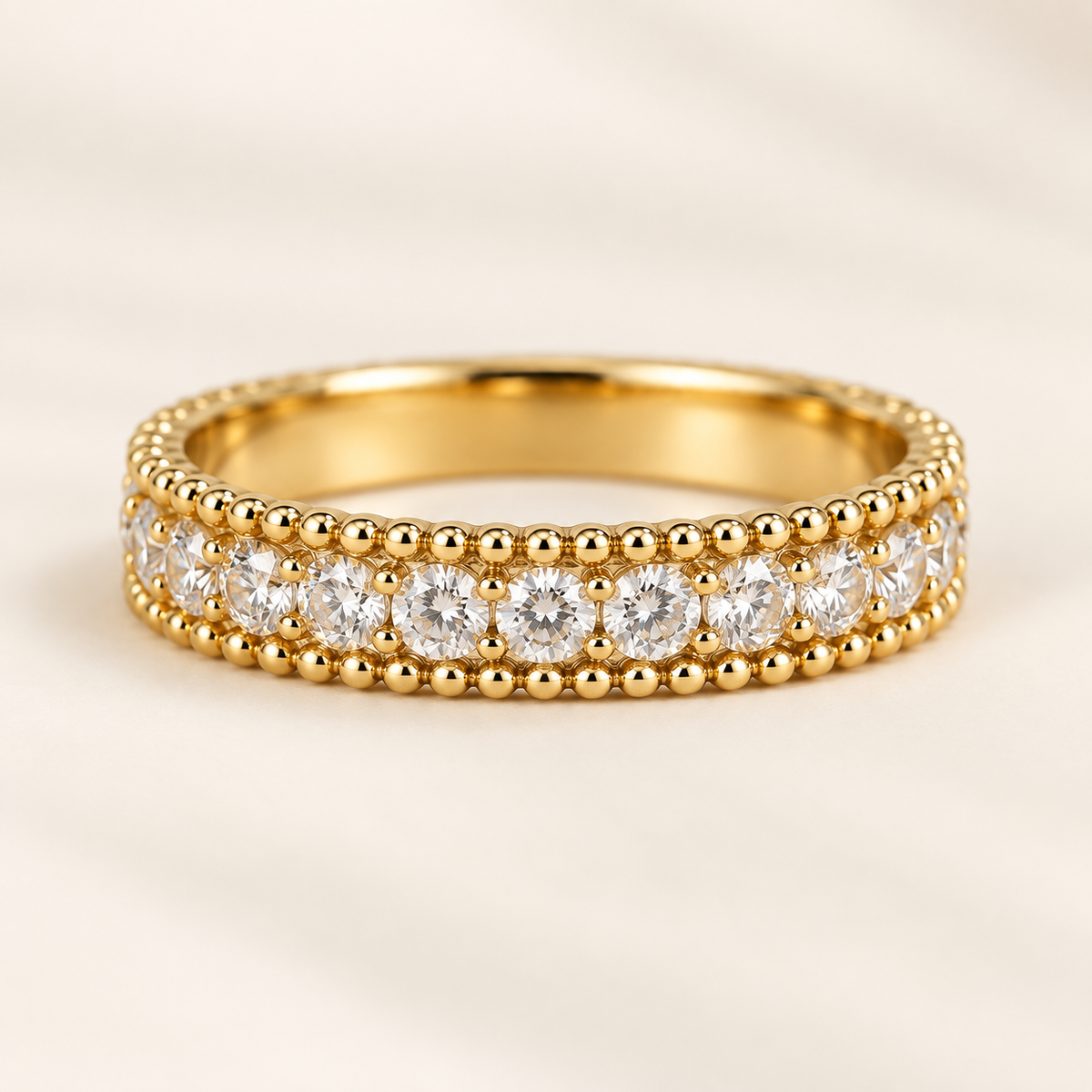 White Tie gold band with a row of clear stones between beaded edges