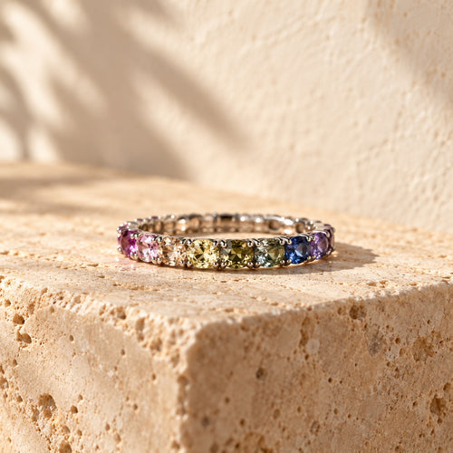 Full Spectrum sterling silver eternity ring set with cushion-cut rainbow stones