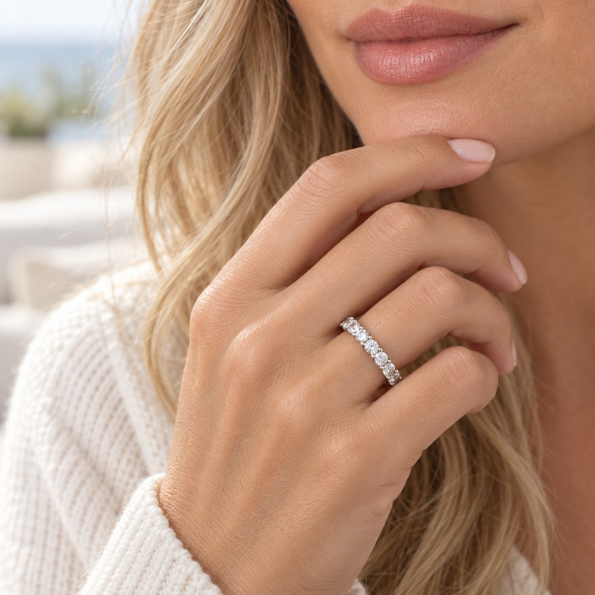 Raise the Stakes sterling silver eternity ring worn outdoors, hand resting at the chin