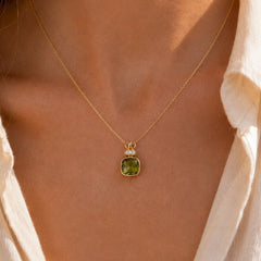 Gemma Olive crystal necklace worn on model, close-up