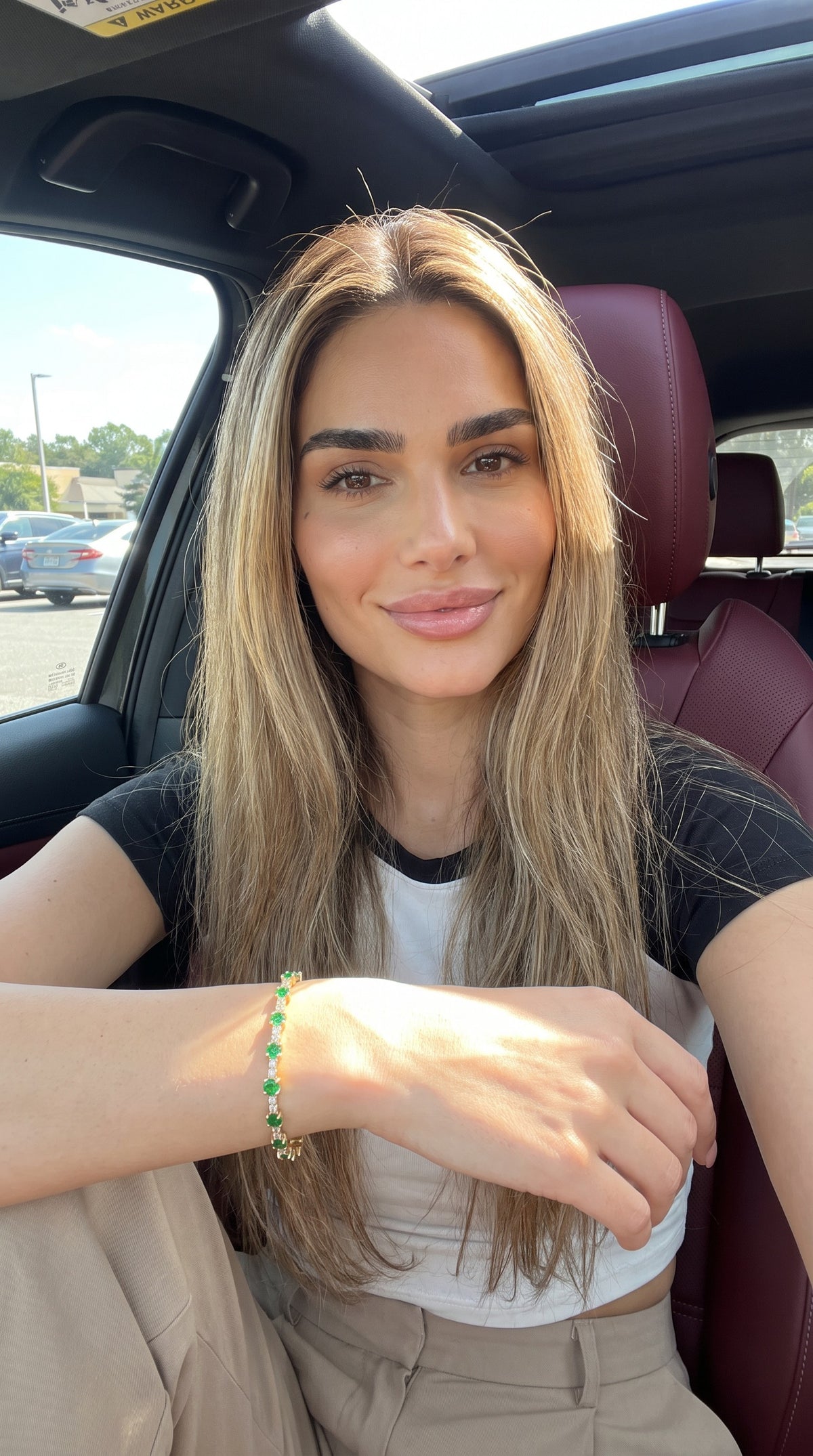 Heart of the Matter emerald tennis bracelet worn on model