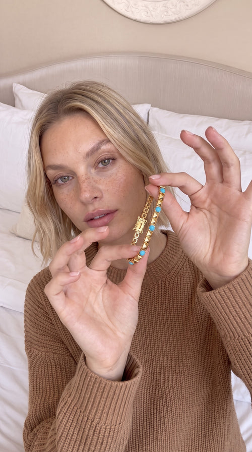Model holding the Linked In bracelet