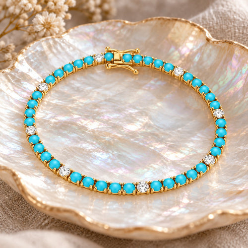 Island Time turquoise tennis bracelet on a mother-of-pearl shell dish