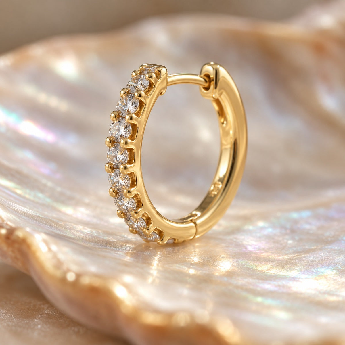 Small Talk huggie hoop close-up showing the prong-set stone row (BU-ER-007)
