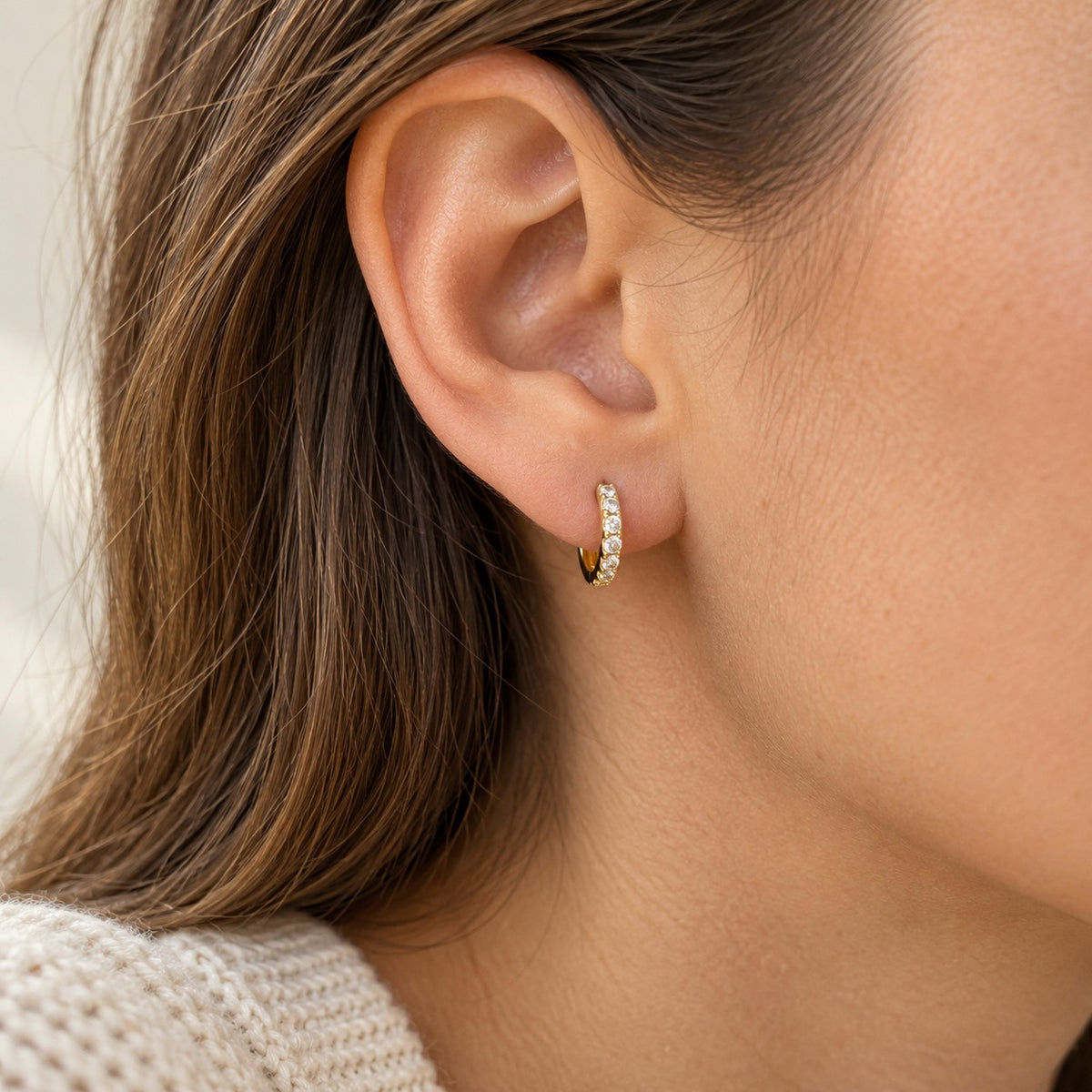 Small Talk gold huggie hoop worn on the ear (BU-ER-007)