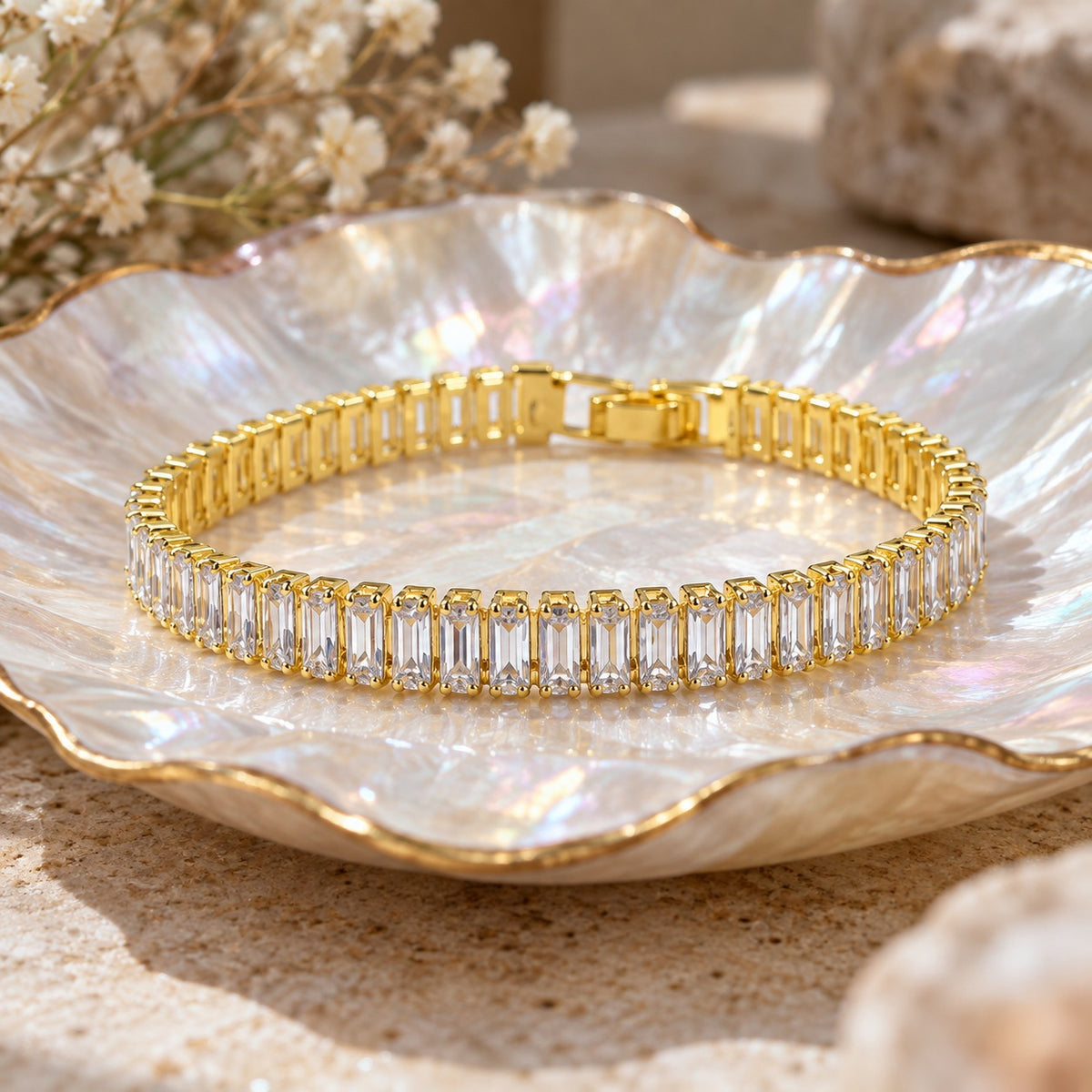 Straight A's baguette bracelet on a mother-of-pearl shell dish