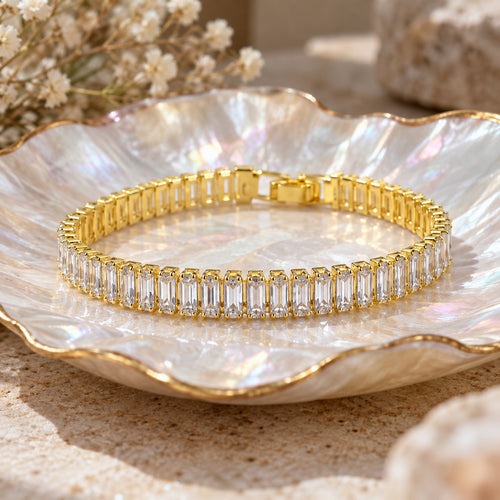 Straight A's baguette bracelet on a mother-of-pearl shell dish